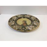 A 19th Century Italian majolica charger in the Urbino or Deruta manner,