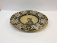 A 19th Century Italian majolica charger in the Urbino or Deruta manner,