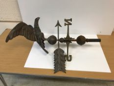 A circa 1900 weather vane with embossed brass spreadeagle surmount, stood upon a ball and arrow,