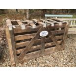 A vintage metal-bound wooden pig weighing crate,