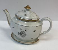 A circa 1800 monochrome and gilt decorated teapot and cover on stand,