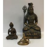 An Indian bronze figure of Shiva seated in double lotus meditative position upon a lion skin rug,