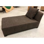 A modern upholstered day bed in dark brown fleck, raised on square block feet, 157.