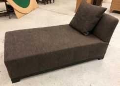 A modern upholstered day bed in dark brown fleck, raised on square block feet, 157.