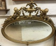 A circa 1900 giltwood and gesso framed wall mirror,