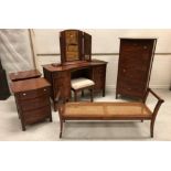 A modern Willis & Gambier cherry wood bedroom suite comprising dressing table and separate mirror,