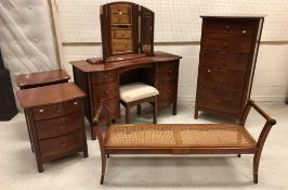 A modern Willis & Gambier cherry wood bedroom suite comprising dressing table and separate mirror,