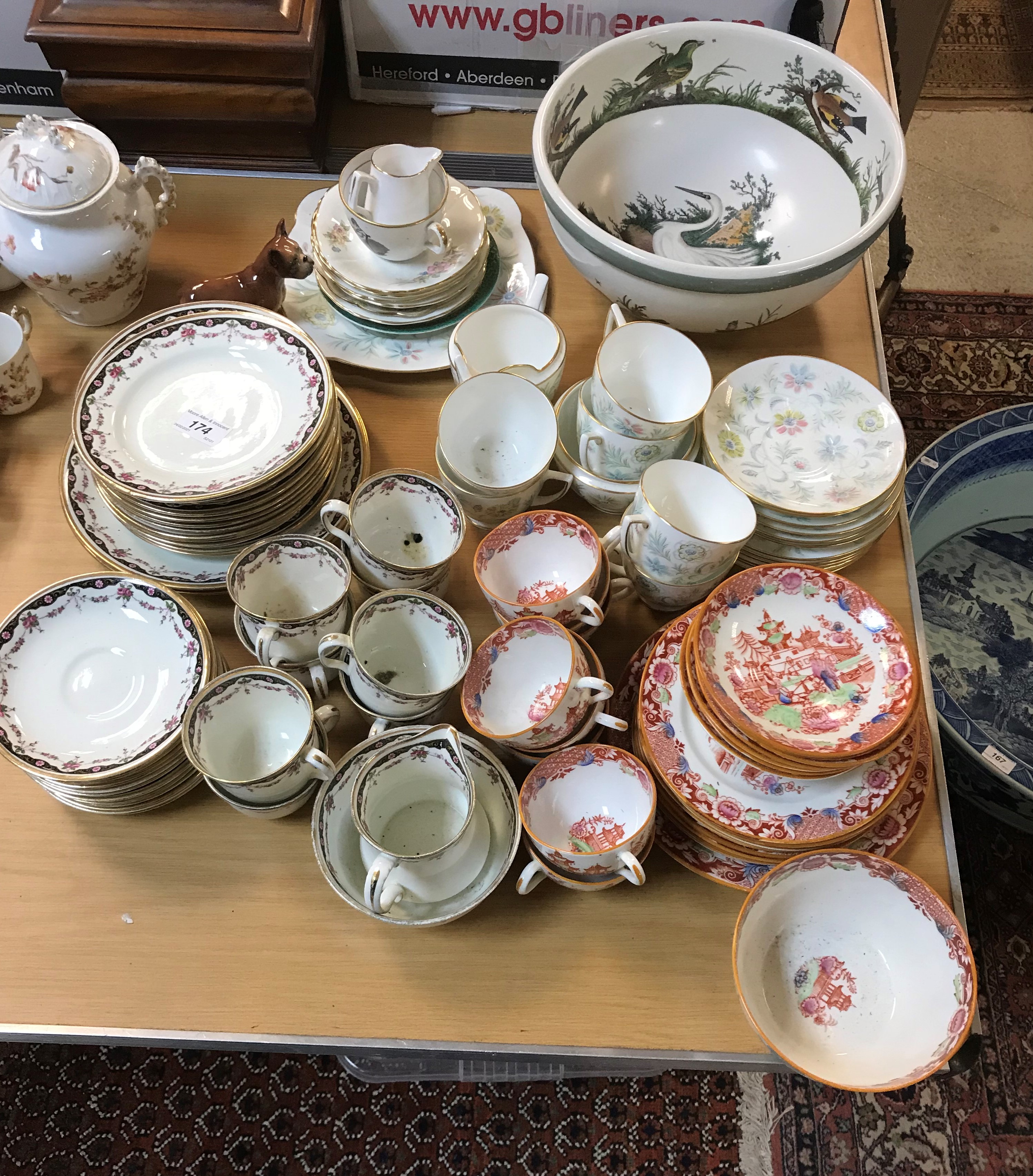 A collection of various china wares to include English chinoiserie decorated oxide red ground