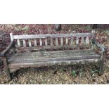 A modern teak slatted garden bench CONDITION REPORTS Some damage and repairs