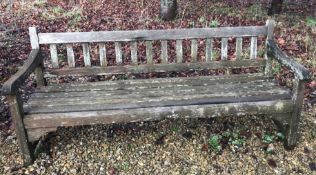A modern teak slatted garden bench CONDITION REPORTS Some damage and repairs