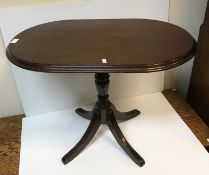 A modern mahognay occasional table by Archer and Smith for Harrods bearign lable to base,