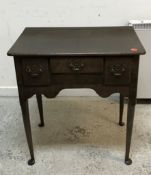 A reproduction oak lowboy in the George III taste,