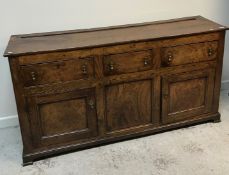 An 18th Century elm enclosed dresser,