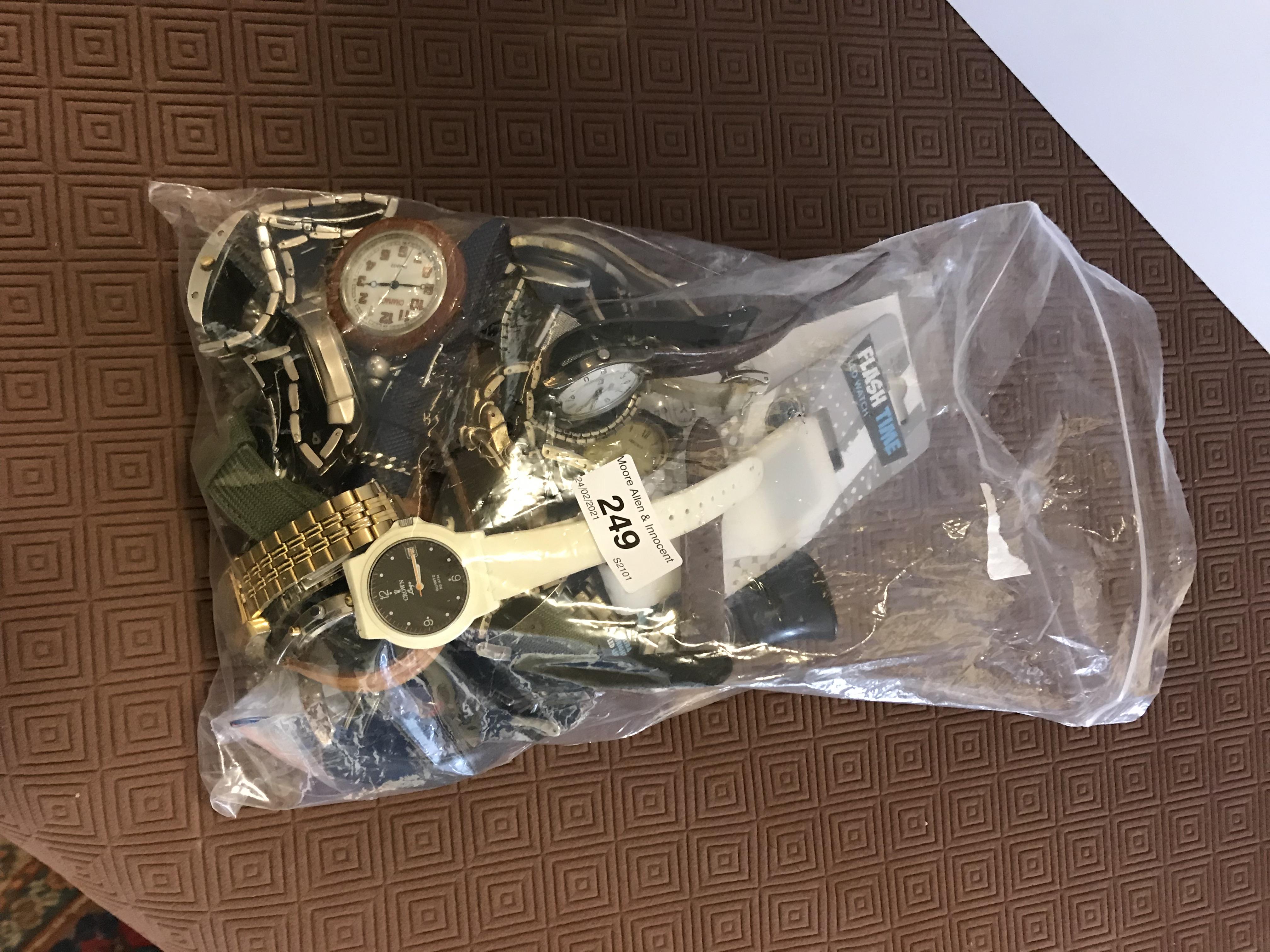 A bag containing 24 various watches, including Swatch, Select, imitation Omega, Solo, Crown,
