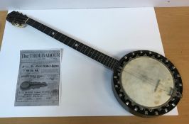 A Barnes & Mullins No. 1 Perfect Banjo with patent mute, 29.