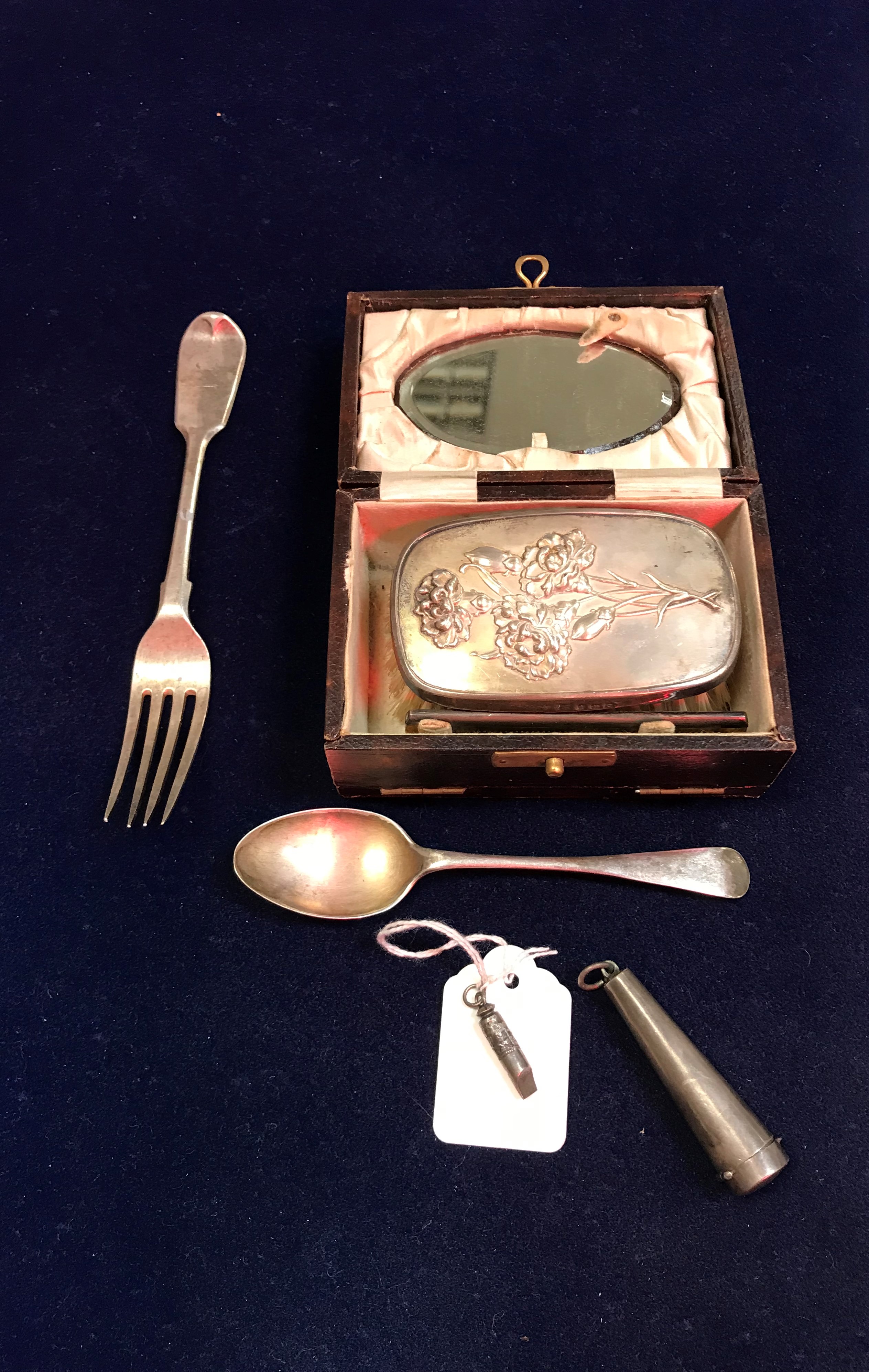 A George V travelling brush set with embossed floral spray decorated backed brush and silver