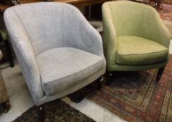 A pair of modern tub chairs, one with grey upholstery, the other in lime green,