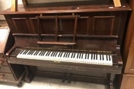 An early 20th Century rosewood cased upright piano,