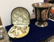 A set of six Victorian tot cups with glass liners and embossed silver holders in the Dutch taste