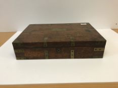 A 19th Century teak and brass bound military style writing box with recesses for pens and inkwells
