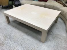 A modern rectangular lacquered coffee table with cream simulated shell decoration on square