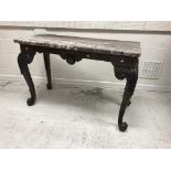 A walnut console table in the early 18th Century manner,