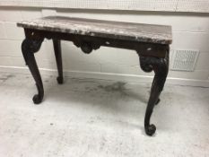 A walnut console table in the early 18th Century manner,