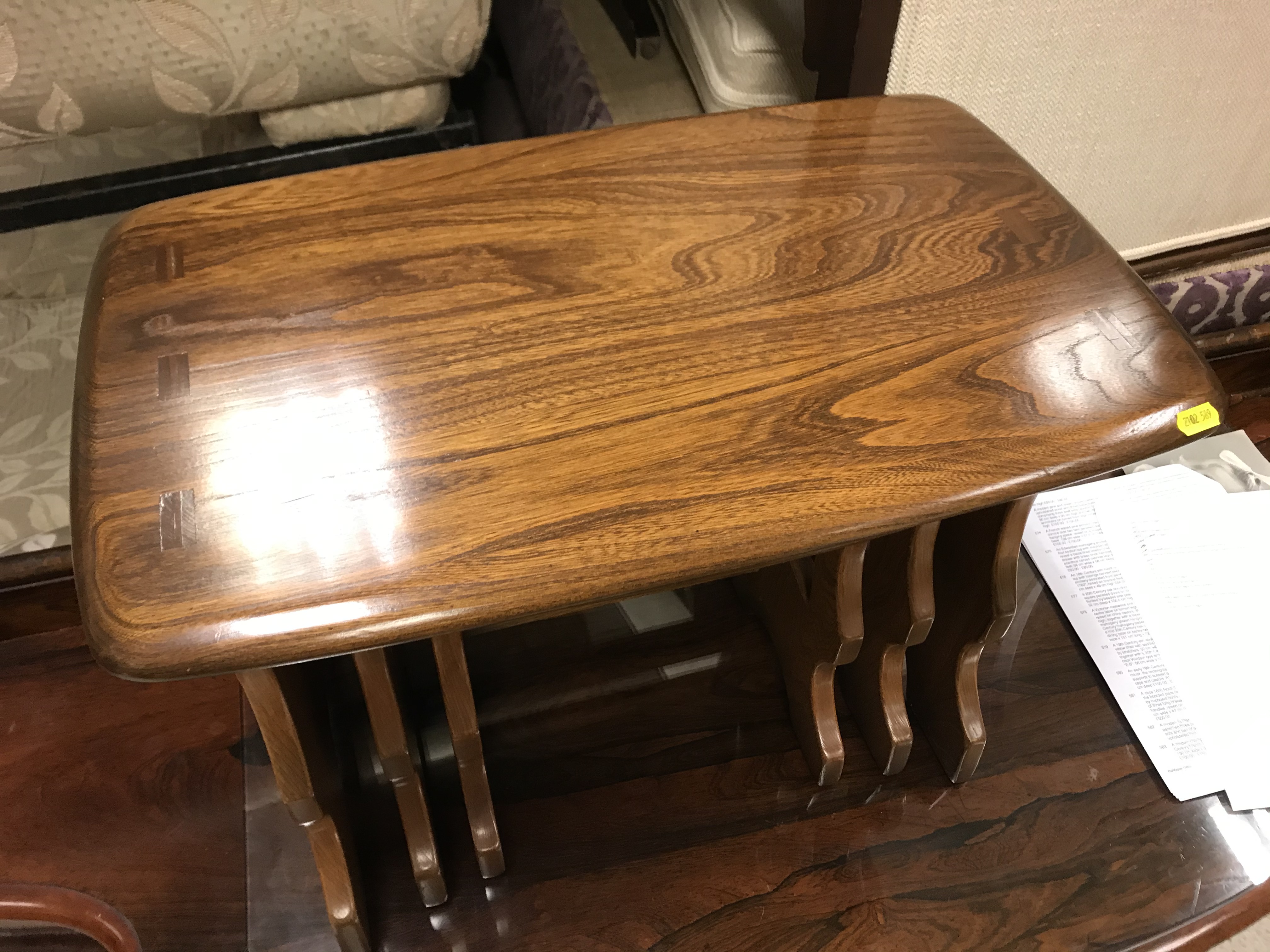 An Ercol elm nest of tables, 57 cm x 35.5 cm x 42 cm high (largest), 34 cm x 25.5 cm x 36. - Image 2 of 25