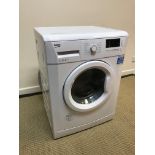 A Beko WM74145W 7 kg 1400 rpm washing machine,