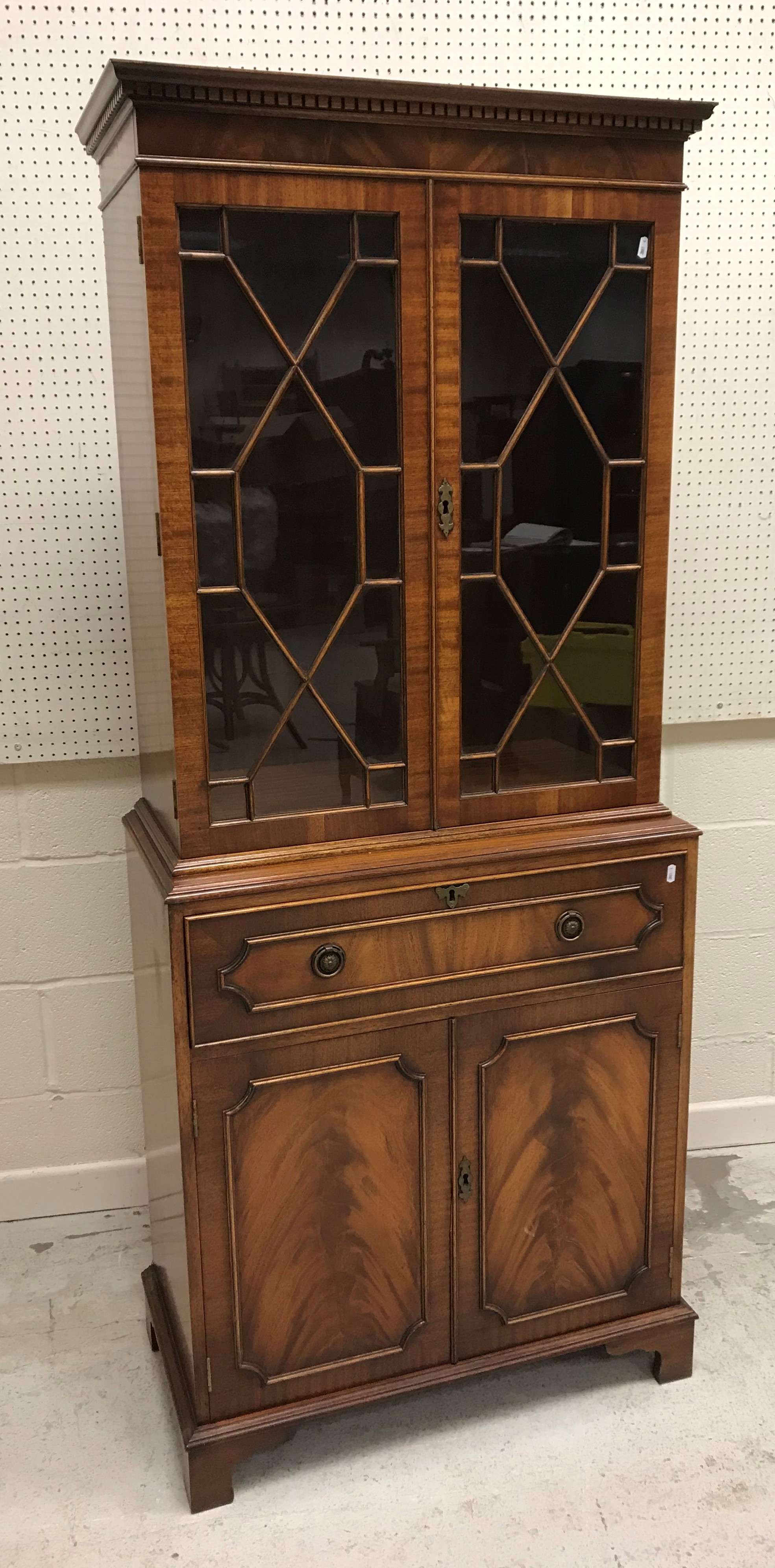 A Bevan Funnell Reprodux mahogany secretaire bookcase with two glazed doors over a fitted drawer