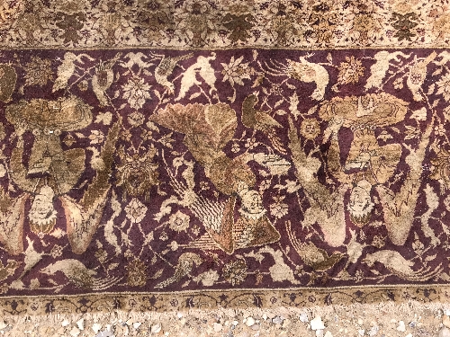 An early 20th Century Agra North India carpet with centre medallion on a wine-coloured ground, - Image 82 of 103