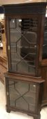 A mahogany freestanding corner cupboard in the George III style,