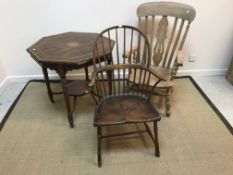 A 19th Century elm stick back Windsor type elbow chair with saddle seat on turned legs united by
