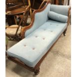 A Victorian mahogany framed chaise longue with moulded show frame and scroll end,