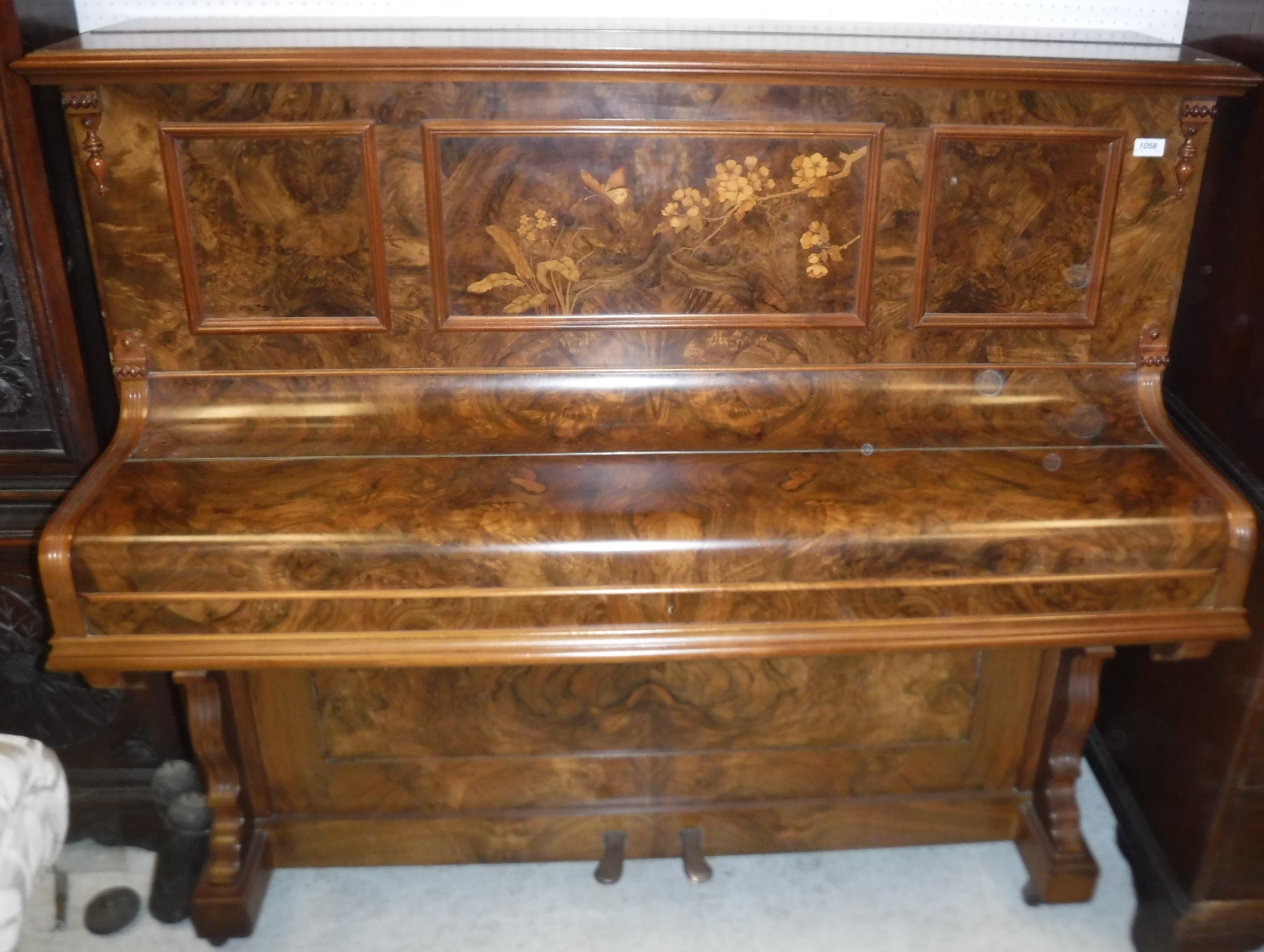 A Russell burr walnut cased upright piano with inlaid decoration and straight string iron framed