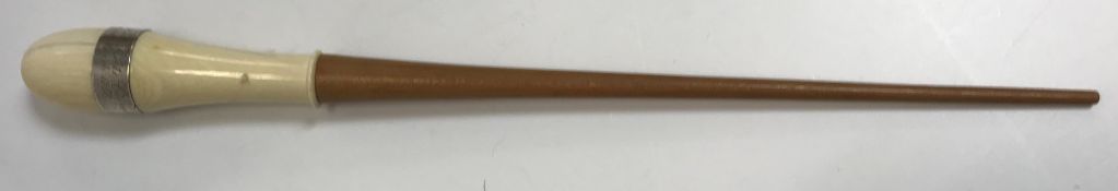 A Victorian presentation turned wooden ivory handled baton with white metal band inscribed “Miss