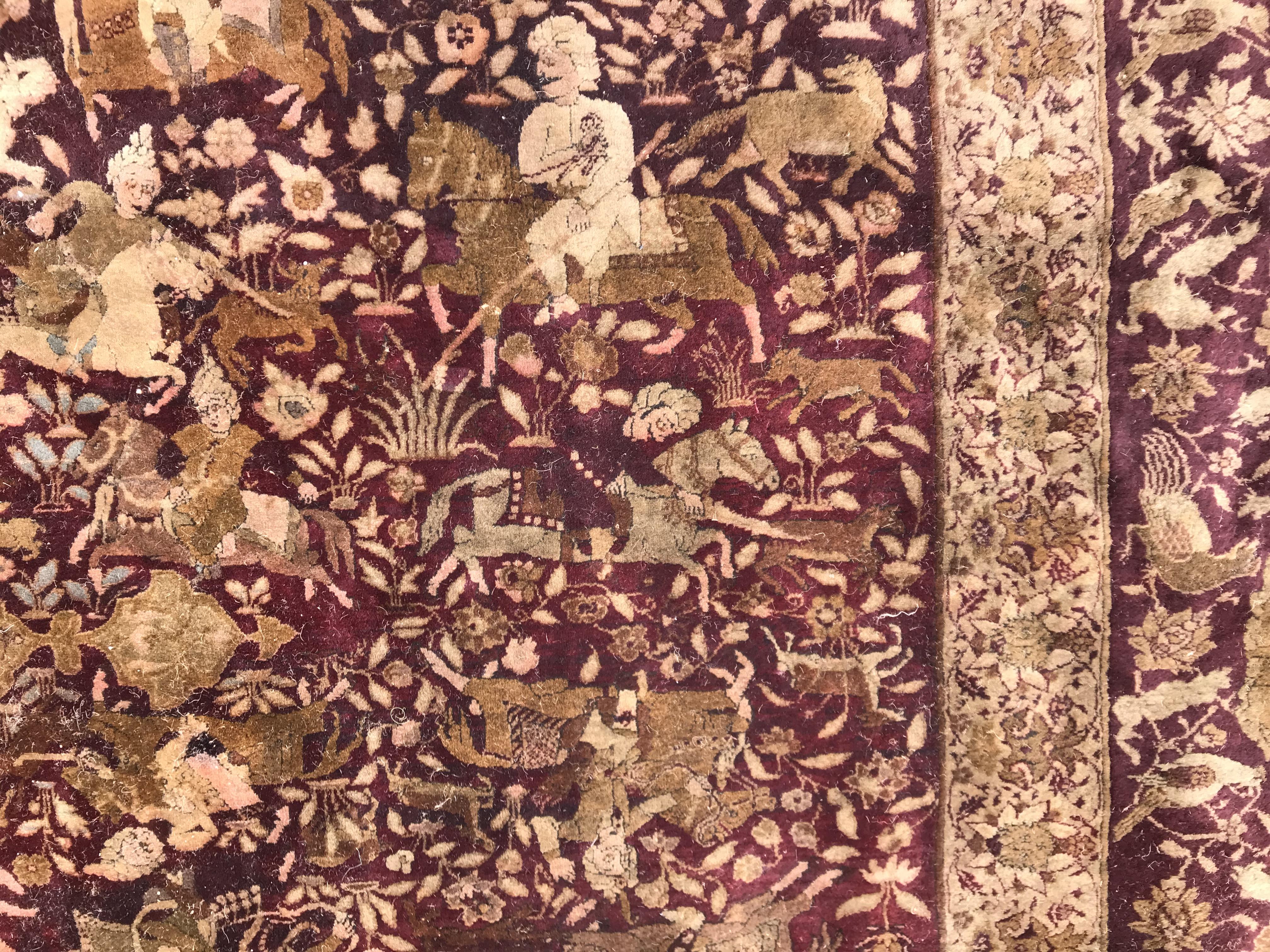 An early 20th Century Agra North India carpet with centre medallion on a wine-coloured ground, - Image 49 of 103