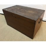 A stained pine trunk of plain form with brass swan neck side handles,