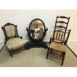 A Victorian carved walnut framed nursing chair with upholstered back panel and seat,