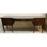 A late George III mahogany breakfront sideboard, the bowed centre section with single frieze drawer,