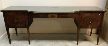 A late George III mahogany breakfront sideboard, the bowed centre section with single frieze drawer,