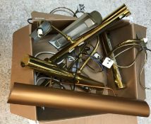 A box containing assorted brass picture lights,