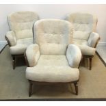 An Ercol stained beech framed bentwood stick back lounge suite comprising two seat sofa,