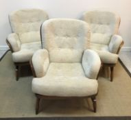 An Ercol stained beech framed bentwood stick back lounge suite comprising two seat sofa,