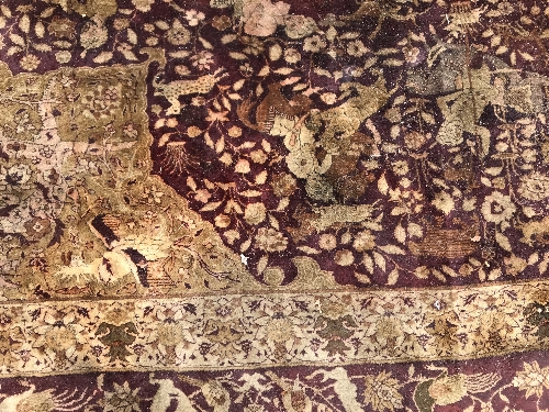 An early 20th Century Agra North India carpet with centre medallion on a wine-coloured ground, - Image 75 of 103