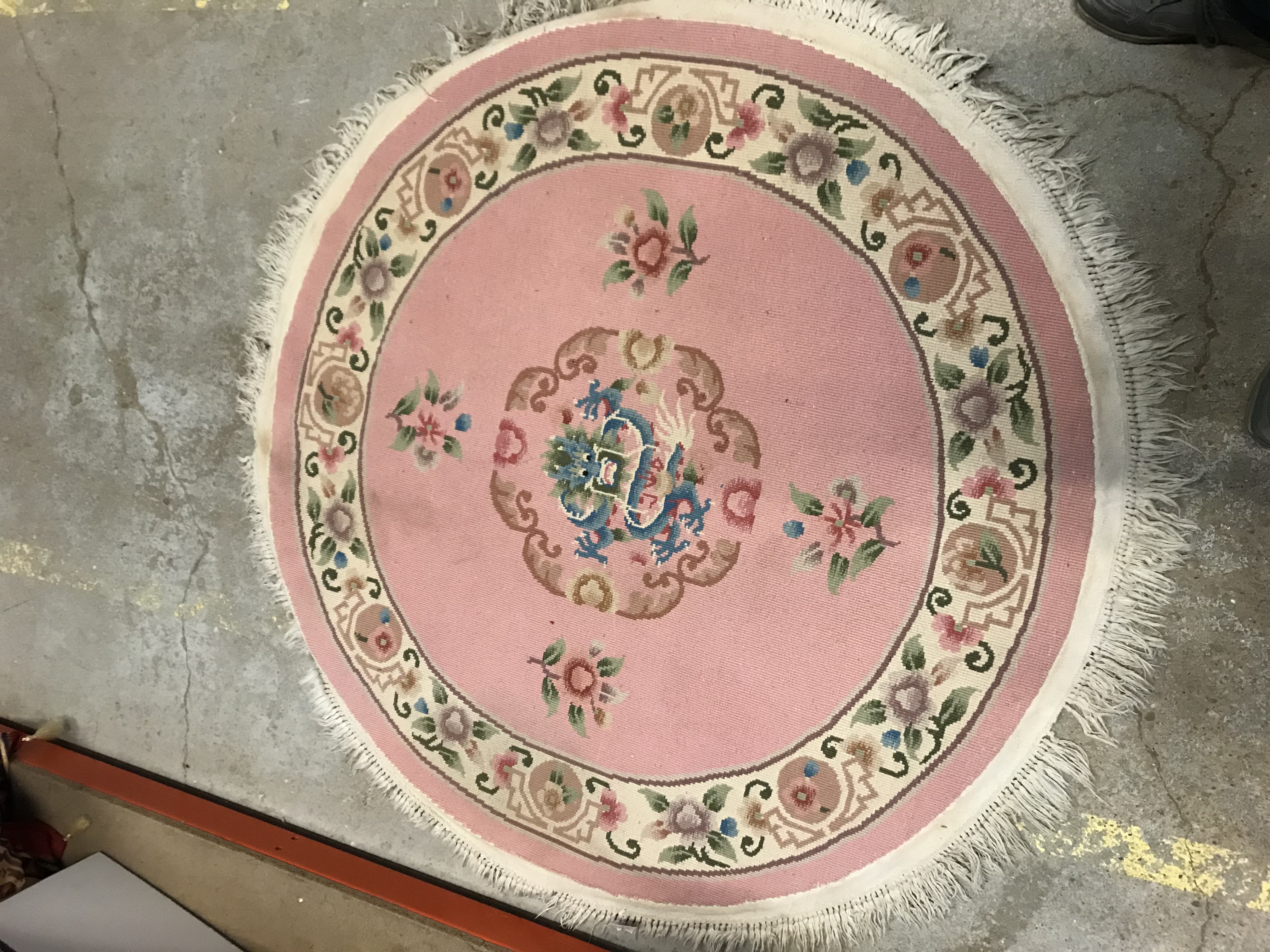 A Chinese rug, the pale pink ground set with floral sprays and central dragon head motif, - Image 3 of 3