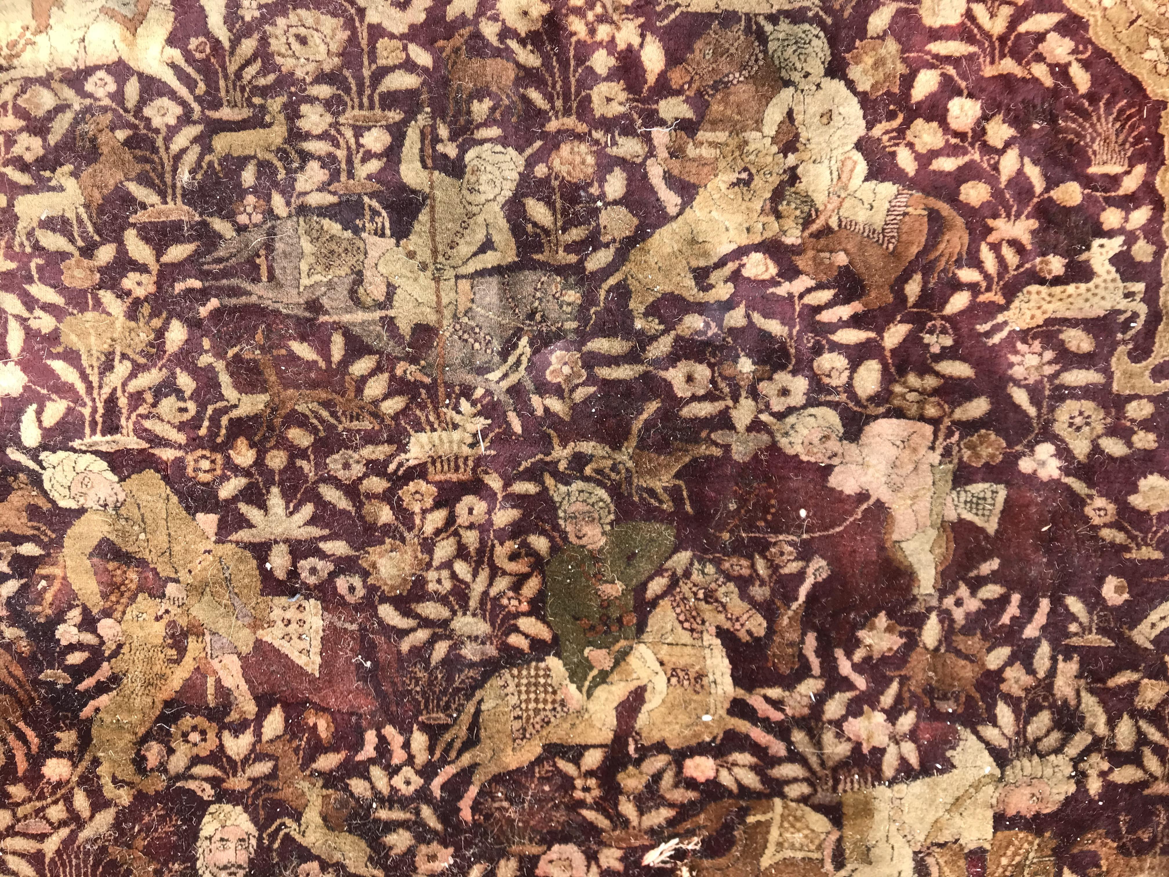 An early 20th Century Agra North India carpet with centre medallion on a wine-coloured ground, - Image 66 of 103