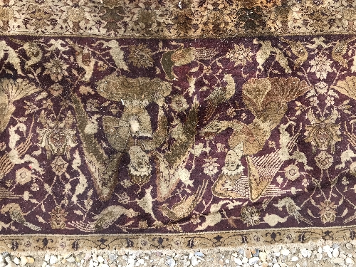 An early 20th Century Agra North India carpet with centre medallion on a wine-coloured ground, - Image 80 of 103