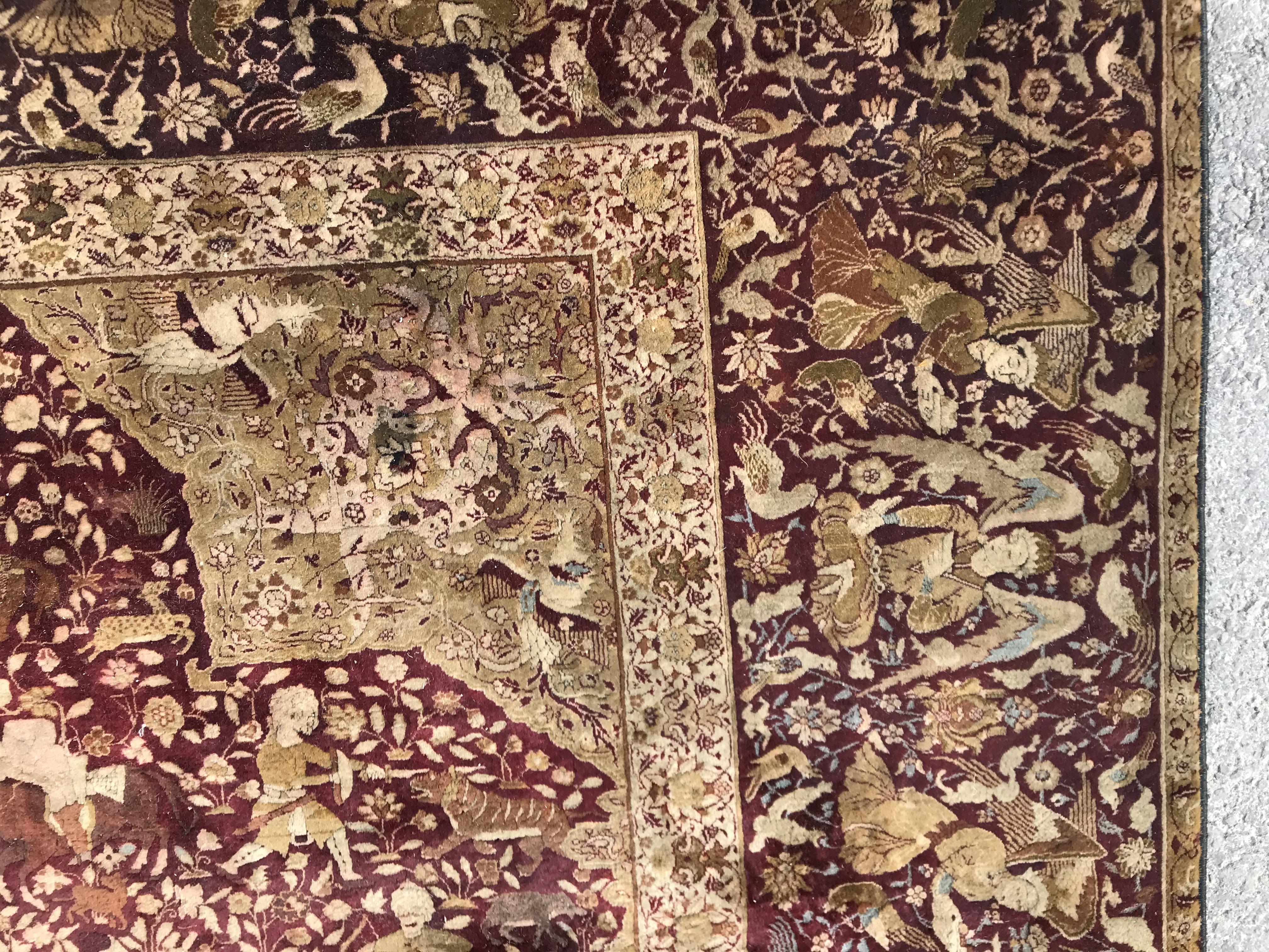 An early 20th Century Agra North India carpet with centre medallion on a wine-coloured ground, - Image 9 of 103