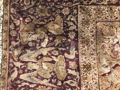 An early 20th Century Agra North India carpet with centre medallion on a wine-coloured ground, - Image 26 of 103